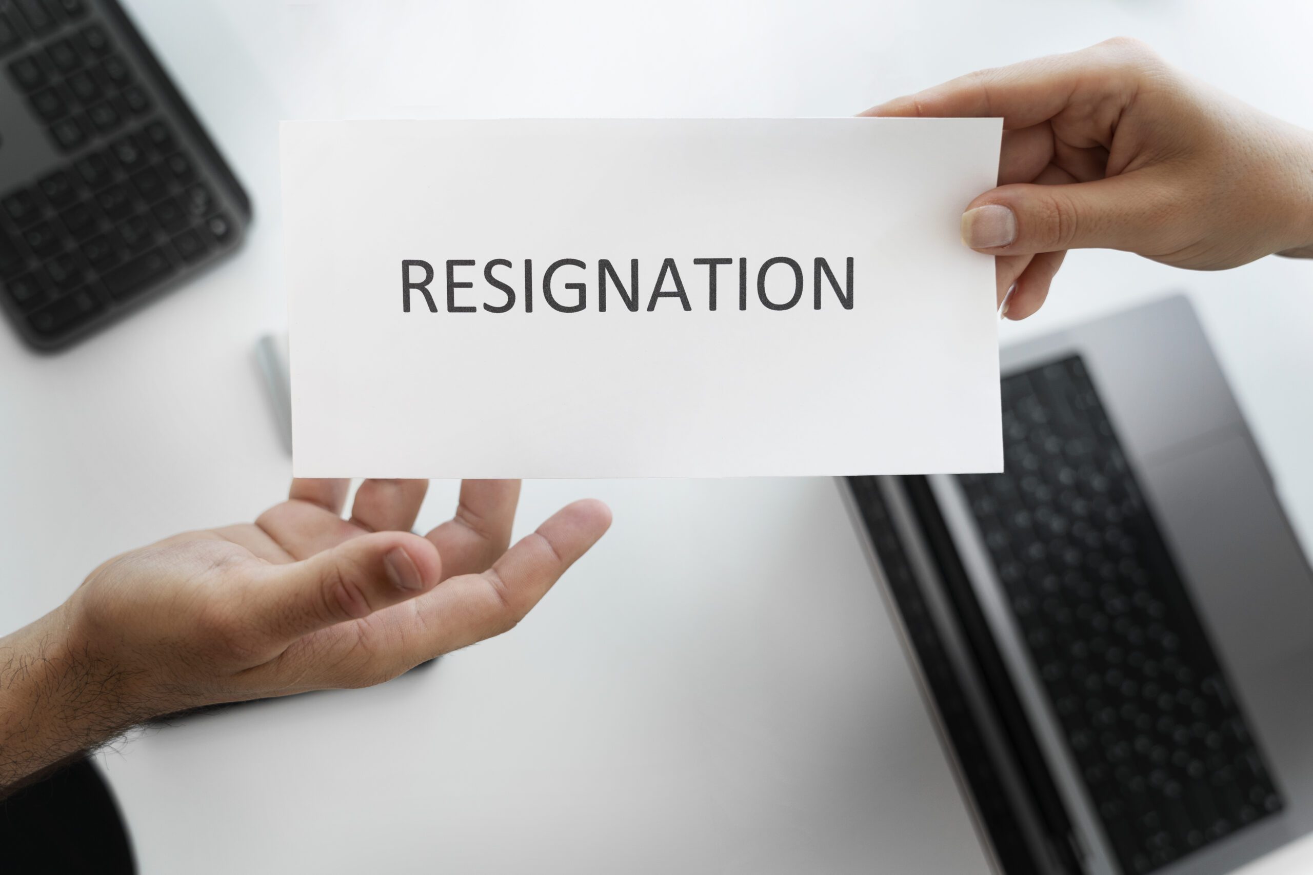 employee-holding-resignation-letter